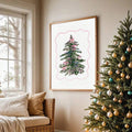 Wall-mounted coquette Christmas tree print above a living room sofa