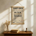Motivational receipt wall art leaning on a console table in a neutral living room