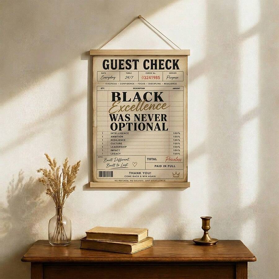 Motivational receipt wall art leaning on a console table in a neutral living room