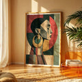 Geometric portrait canvas styled on a woven console beside a glass vase