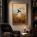 Ghost witch painting above an armchair with books and a candlelit table