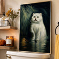 Dark white cat canvas poster in a slim gold frame styled on a Halloween bathroom shelf