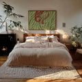 Red heel and green zebra stripe canvas print styled in a bright living room
