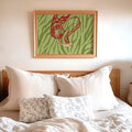 Abstract fashion canvas poster displayed in a light wood frame in a bedroom