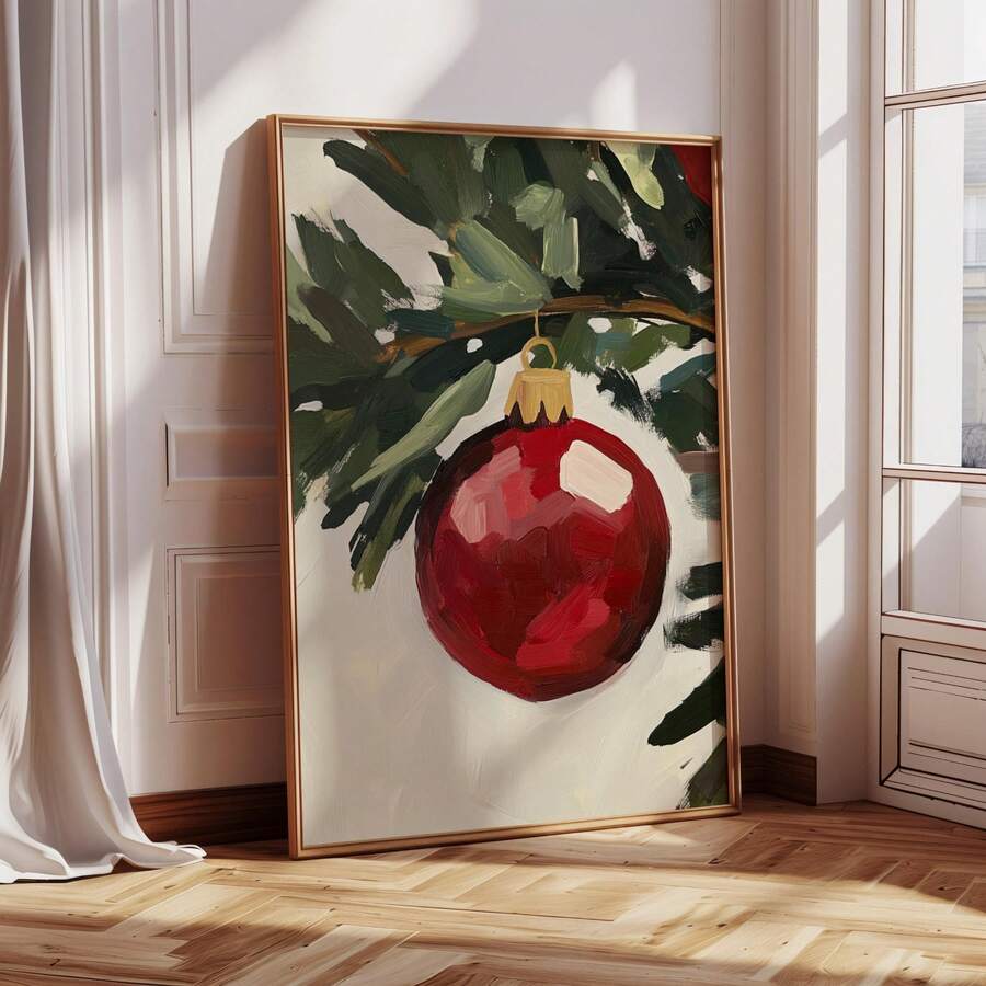 Framed red Christmas bauble canvas leaning in a bright room by a window