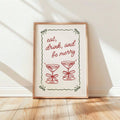 Eat drink and be merry wall art print displayed beside a Christmas tree and window
