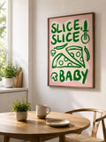 Retro pink and green pizza wall art displayed in a bright dining nook