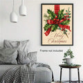 Framed holly and plaid ribbon canvas poster above a living room sofa
