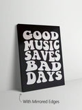 Black and white groovy typography wall art in a pale wood frame beside a mirror