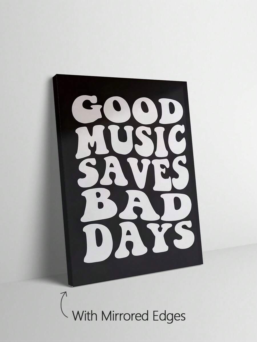 Black and white groovy typography wall art in a pale wood frame beside a mirror