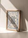 Galatians scripture botanical canvas poster in a light wood frame on a white shelf