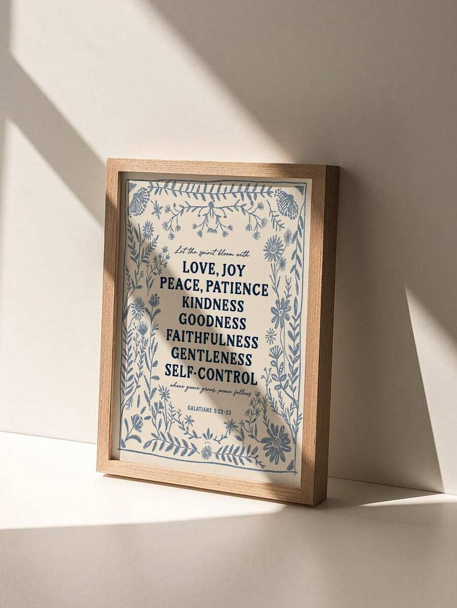Galatians scripture botanical canvas poster in a light wood frame on a white shelf