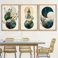 Abstract tree branch canvas poster set displayed over a dining table with rattan chairs