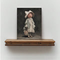 Pumpkin-headed lady canvas portrait displayed in a light wood frame