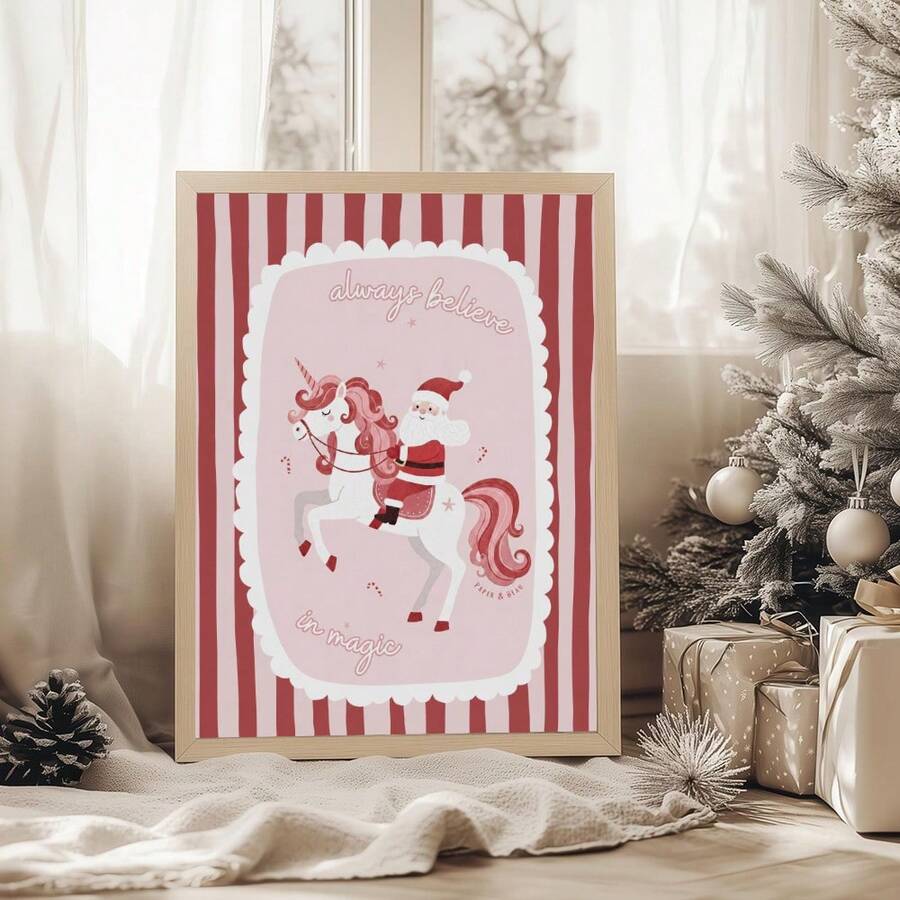 Pink Santa unicorn canvas poster displayed beside a snowy Christmas tree