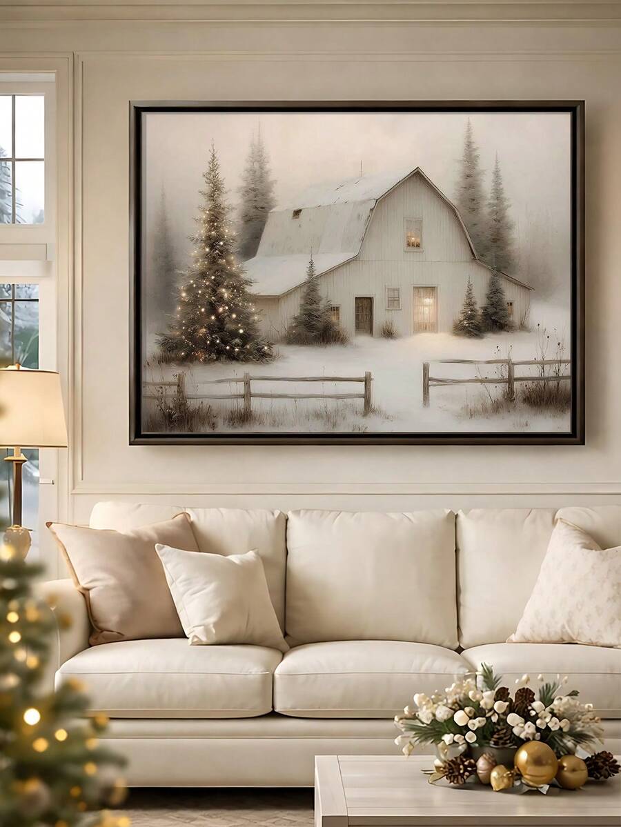 Framed snowy Christmas barn canvas poster displayed above a console with candles and pinecones