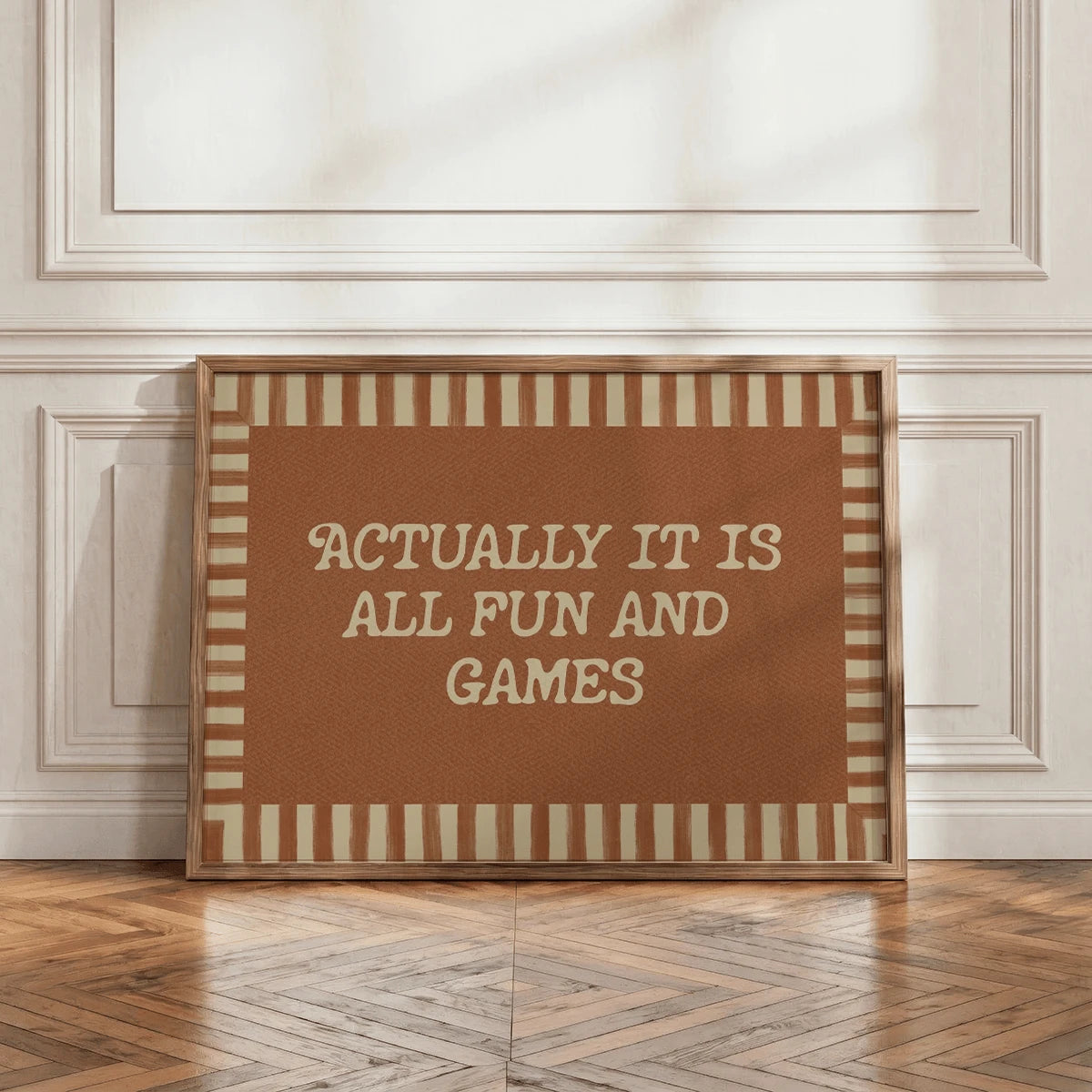Light wood framed typography art with warm brown background and cream text