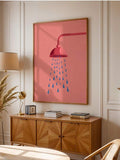 Framed shower rain poster above a wooden cabinet