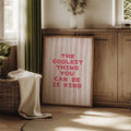 Pink kindness quote canvas poster above a console table