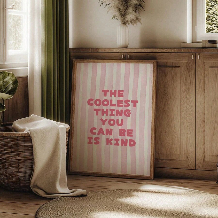 Pink kindness quote canvas poster above a console table