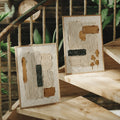 Grooved plaster abstract canvas art in a boho stairwell setting