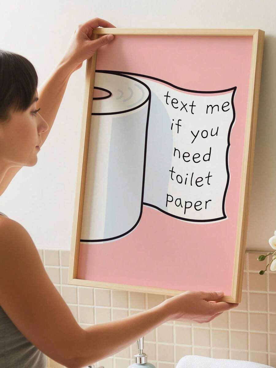 Funny pink bathroom wall art with illustrated toilet paper roll and hand-drawn slogan