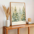 Snowy evergreen holiday print displayed in a warm wood frame