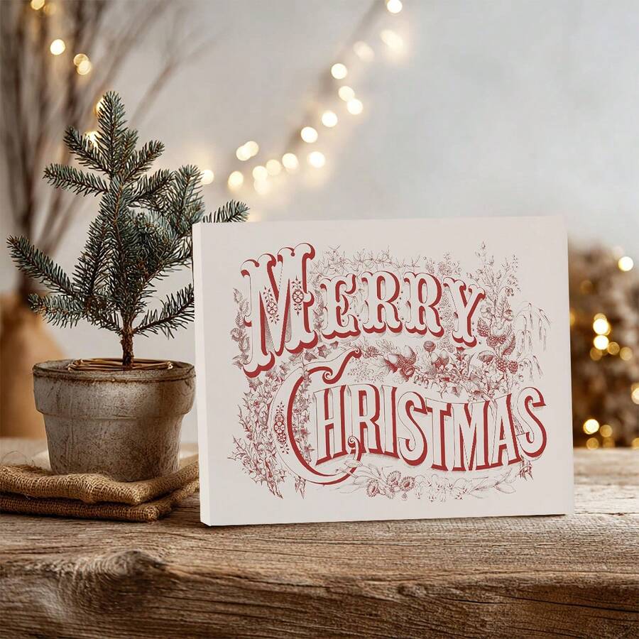 Neutral Christmas canvas print displayed with a small evergreen tree and warm lights