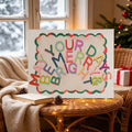 Merry and Bright canvas poster in a cozy snowy window Christmas room setting