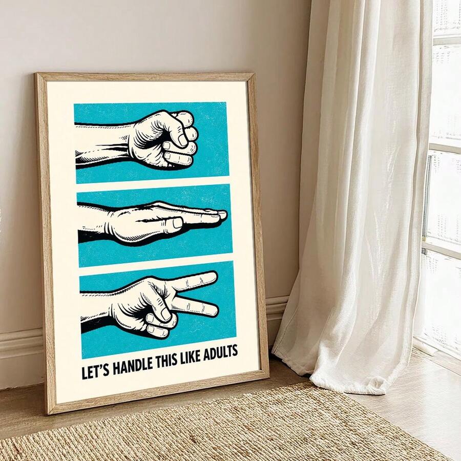 Framed turquoise rock paper scissors quote poster beside a bar cart