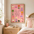 Pink retro canvas poster displayed in a bright living room with a velvet ottoman