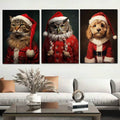 Three red-and-white Santa animal portrait prints above a neutral sofa