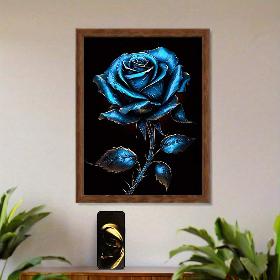 Framed luminous blue rose wall art above a wood console with plants