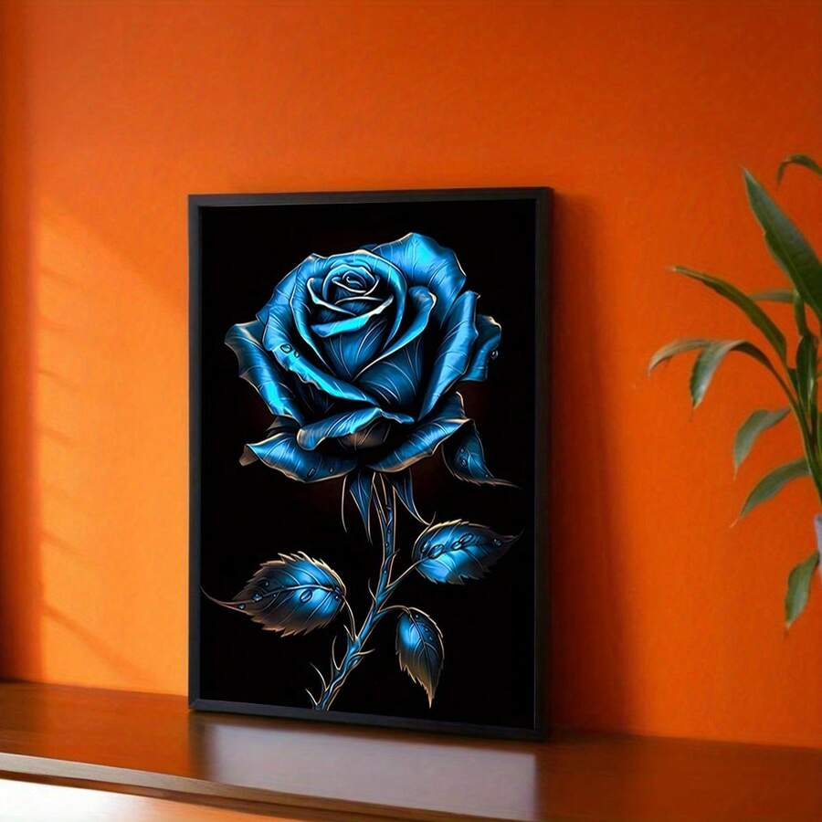 Modern blue rose wall art in a black frame against an orange accent wall