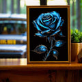 Blue rose floral poster in a wood frame on a tabletop display