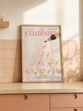 Watercolor cocktail poster displayed on a dining table in a slim wood frame