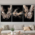 Black love prints featuring clasped hands and script over a pale sofa