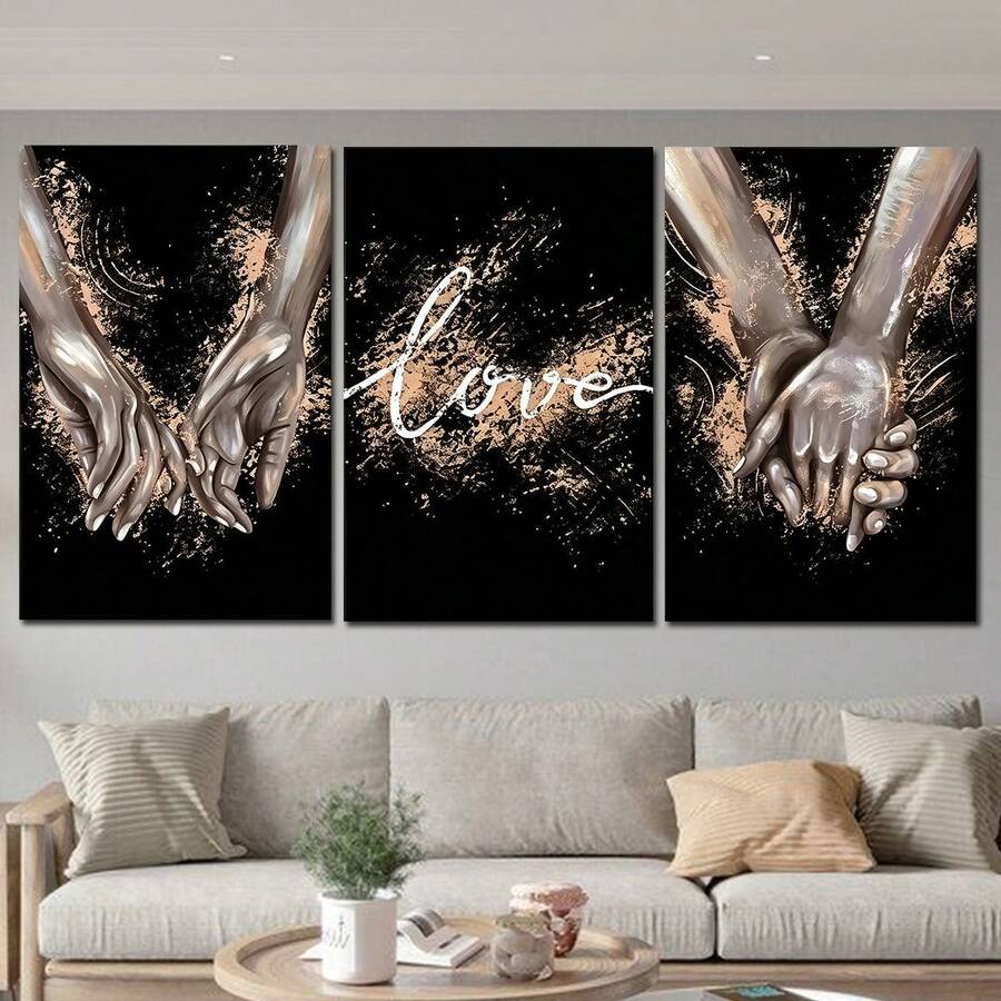 Black love prints featuring clasped hands and script over a pale sofa