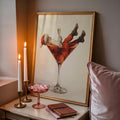 Santa cocktail canvas poster styled with candles and a pink accent pillow