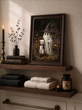 Vintage ghost and toilet paper canvas above dark wood shelves with folded towels and candlelight