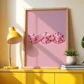 Three pink heart dice minimalist wall art in a light wood frame