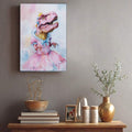 Pink T-rex princess artwork above a console with books and decor