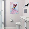Pink dinosaur princess canvas styled on a pale wall in a bathroom