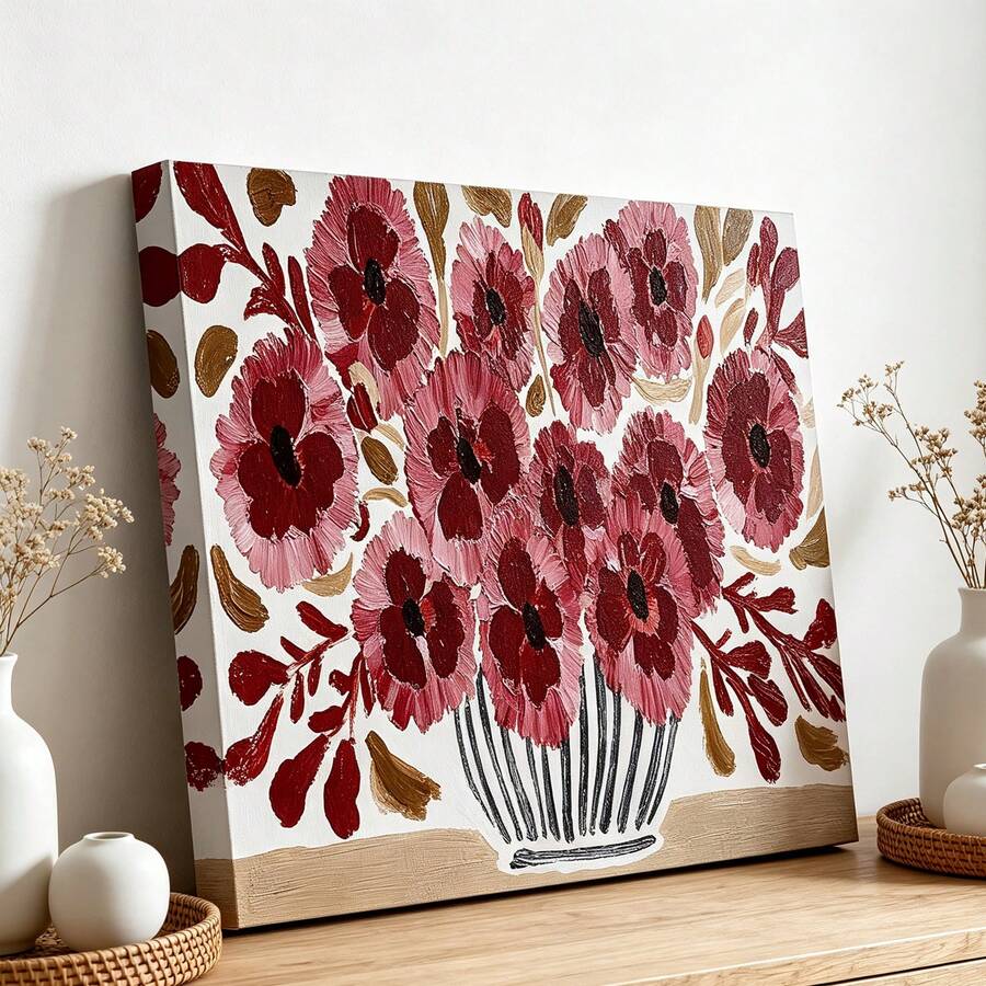 Close view of burgundy and dusty rose flowers with ochre leaves in a drawn vase