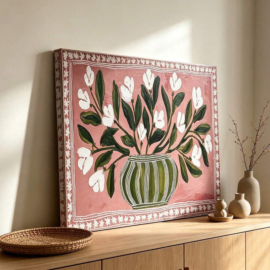 Pink botanical canvas wall art displayed above a wooden dining table