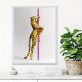 Leopard pole dancer wall art displayed beside a leafy plant