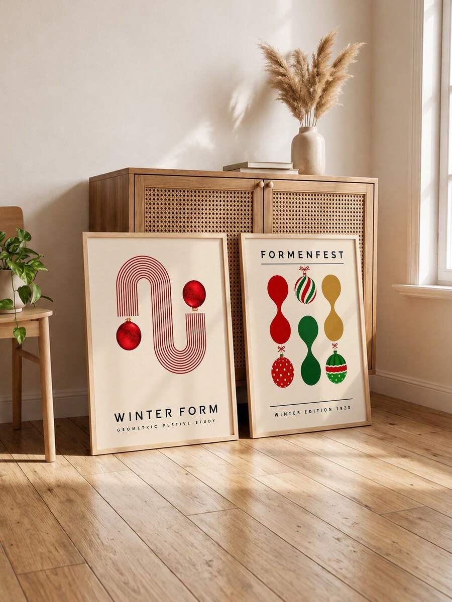 Mid-century ornament poster pair leaning beside a wood cabinet