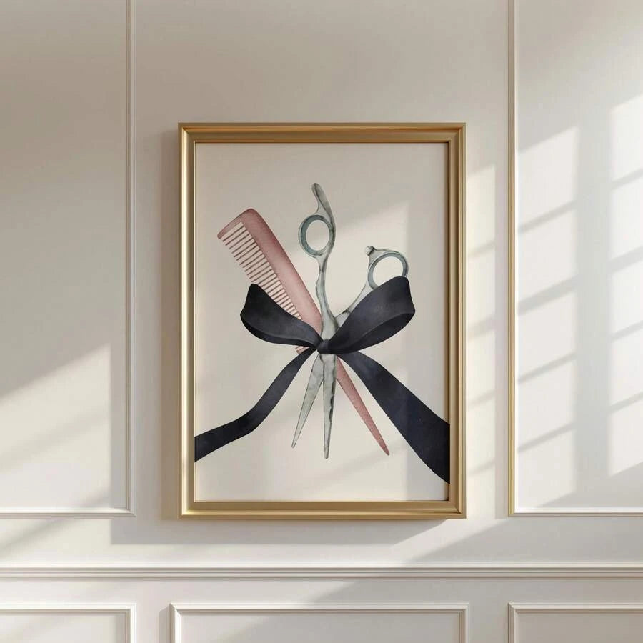 Scissors and pink comb watercolor artwork with a black ribbon bow in a gold-toned frame on a sunlit paneled wall