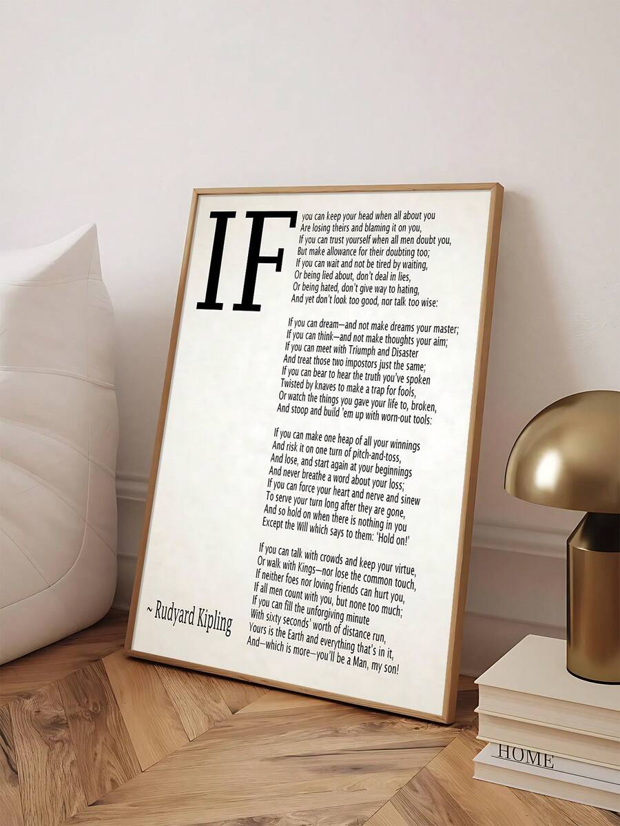 Angled light wood frame displaying Kipling poem print beside lamp and books