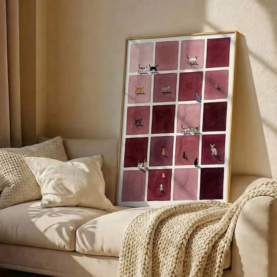 Mid-century burgundy cat grid canvas poster leaning on a cream sofa